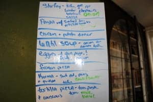 white board with meal ideas listed including stir fry, pasta, and tortilla pizza