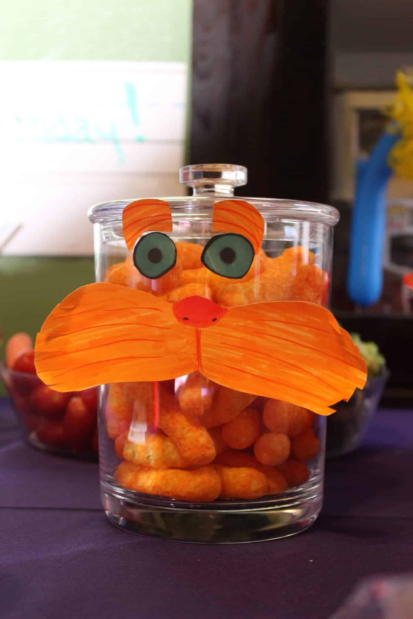 Dr. Seuss Party food - Jar of cheese puffs with Lorax