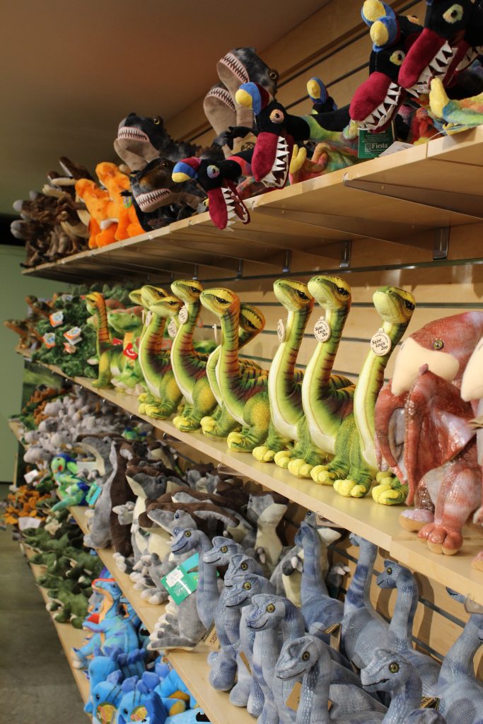 row of stuffed dinosaurs gift shop